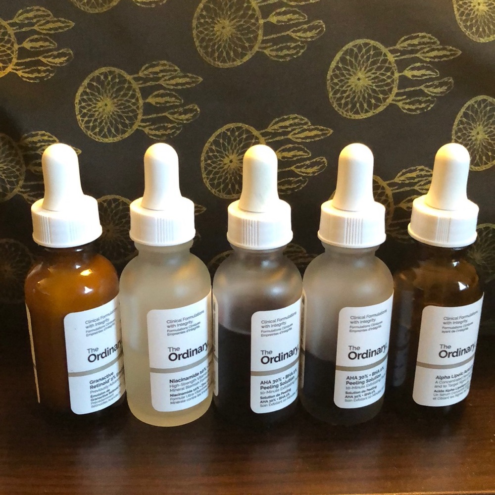 Used bottles of The Ordinary skincare.